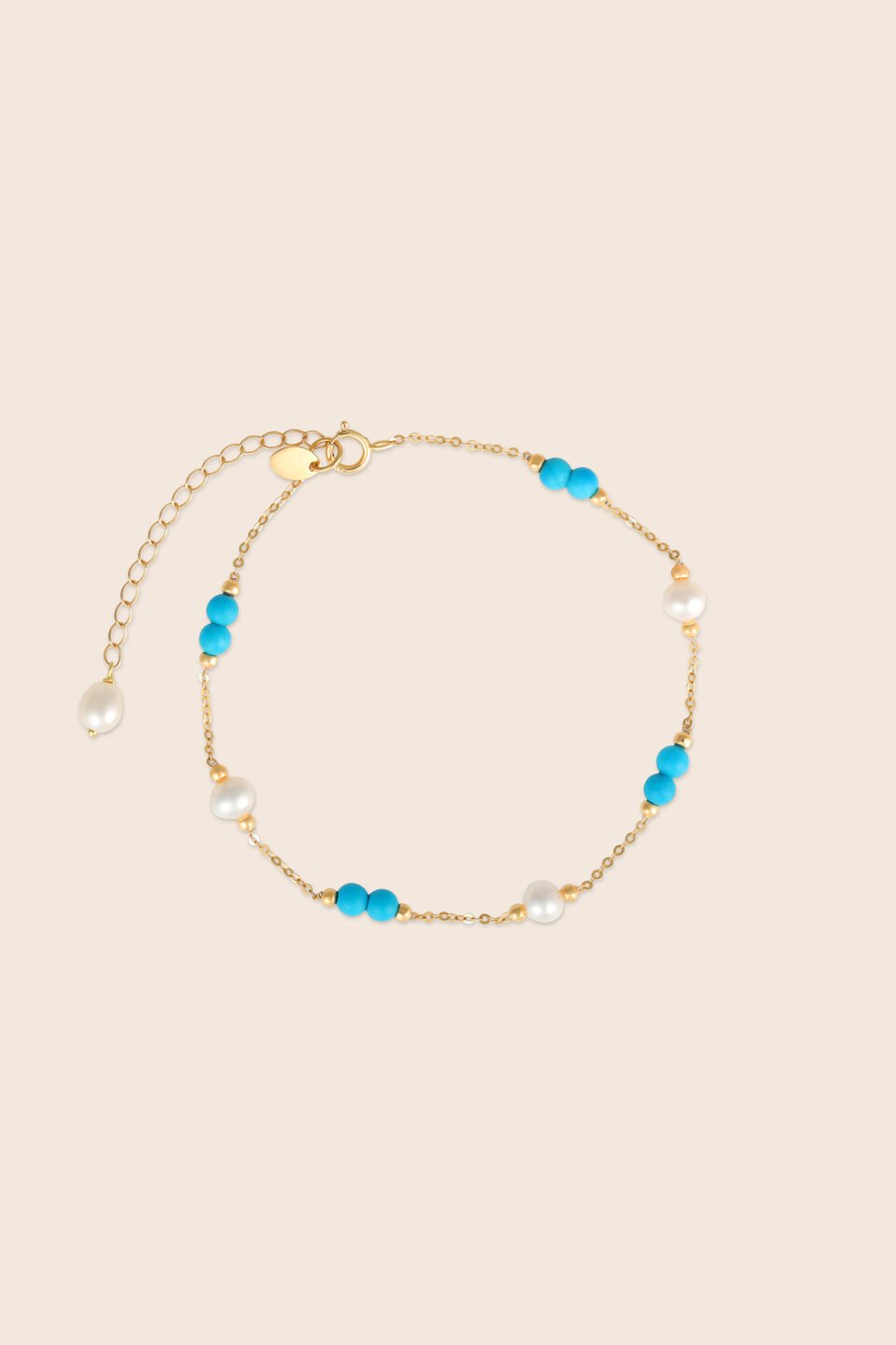 Lavita yellow gold pearl bracelet with two consecutive turquoise beads