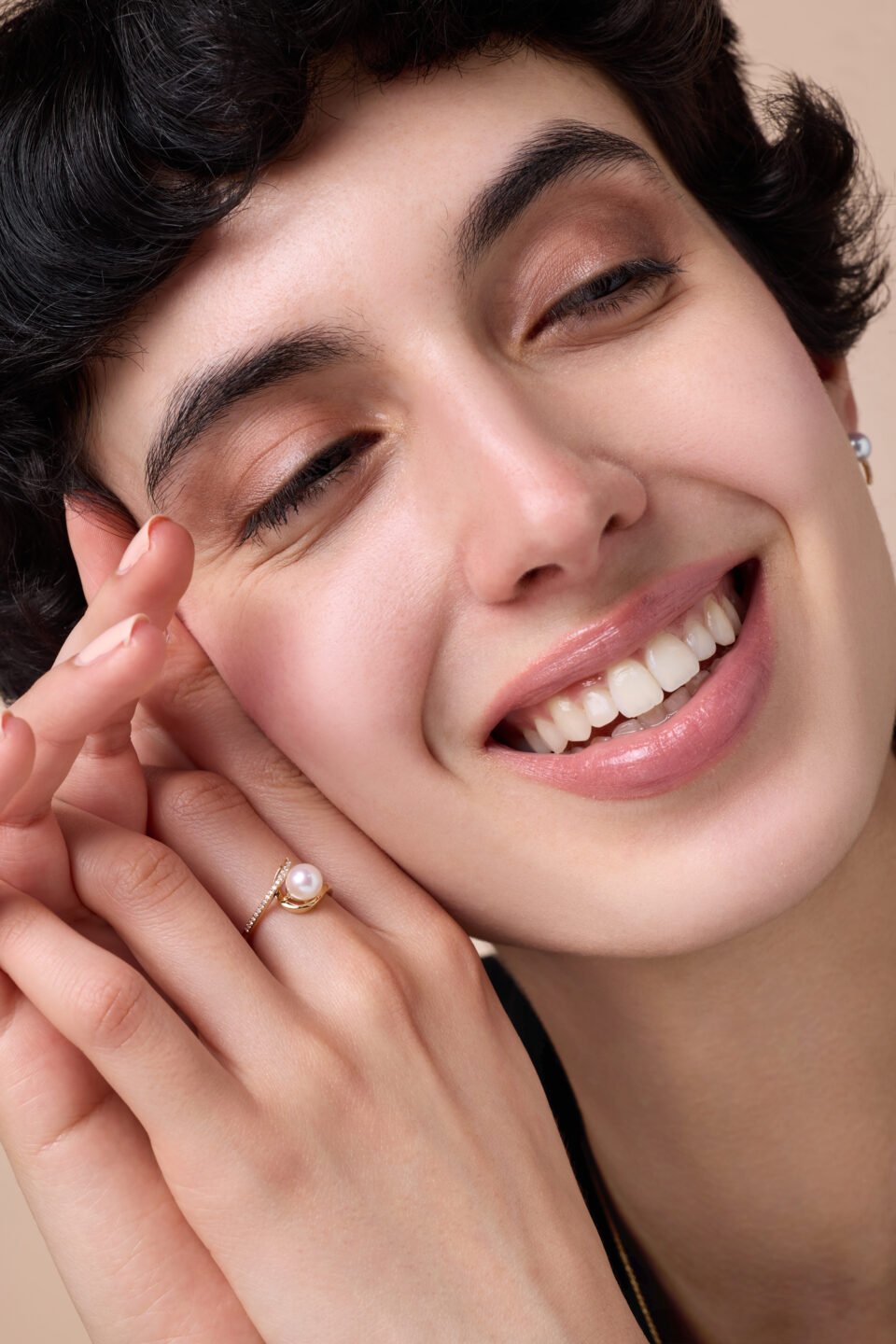 lavita yellow gold ring with central pearl and diamond swirl